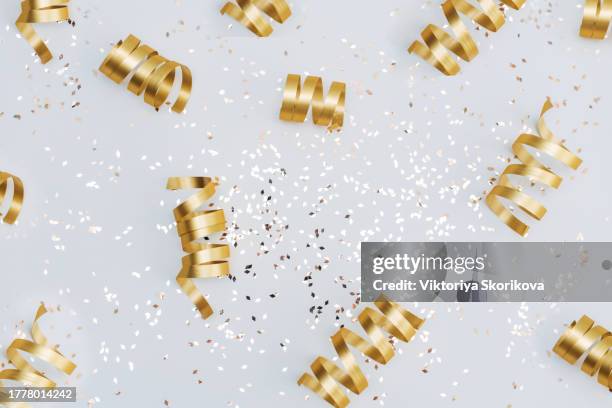 golden confetti on white background. festive, party or holiday glitter backdrop. flat-lay, top view. - top lay wine stock-fotos und bilder