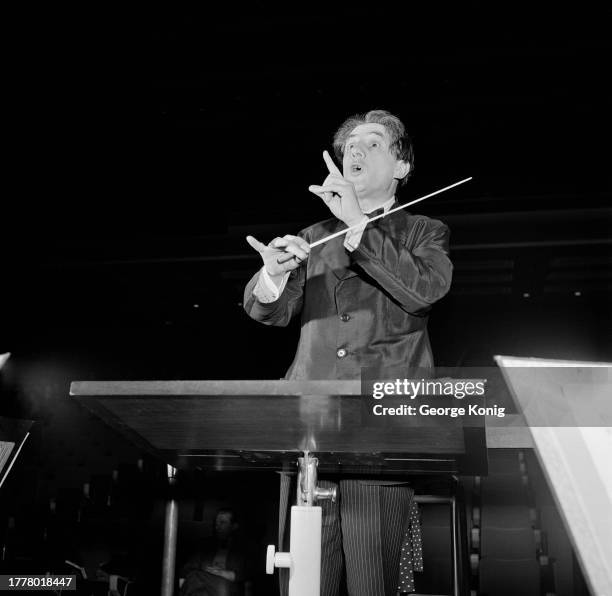 British conductor Sir John Barbirolli conducting the Hallé Orchestra during a rehearsal, January 1952.