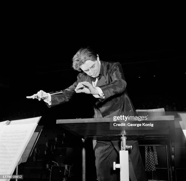 British conductor Sir John Barbirolli conducting the Hallé Orchestra during a rehearsal, January 1952.