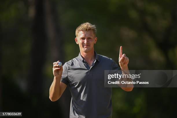 Jonathan Goth-Rasmussen of Denmark celebrates after making a hole-in-one on the 10th hole during Day Three of the final stage of the DP World Tour's...