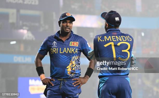 Angelo Matthews and Kusal Mendis of Sri Lanka interact during the ICC Men's Cricket World Cup India 2023 between Bangladesh and Sri Lanka at Arun...