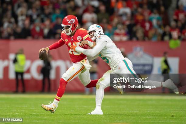 Patrick Mahomes of Kansas City Chiefs and Jalen Ramsey of Miami Dolphins battle for the ball during the NFL match between Miami Dolphins and Kansas...