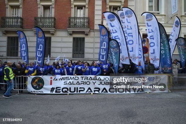 Members of the police unions JUPOL and CEP together with the Civil Guard associations JUCIL and AEGC with a banner during a protest in front of the...