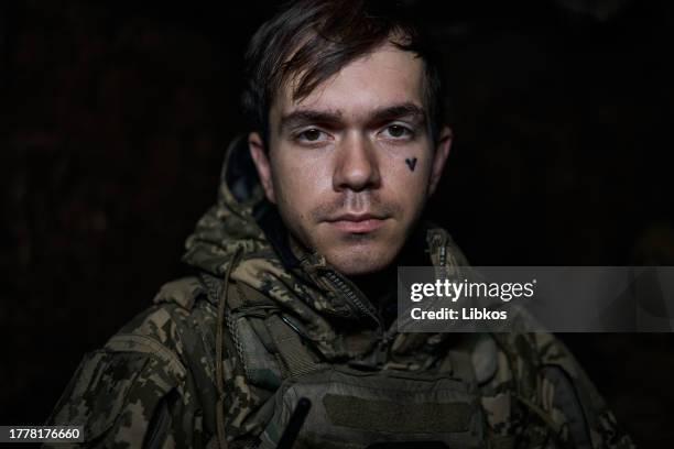 Portrait of a Ukrainian military man as the special unit "Achilles" is preparing to carry out a combat mission at night on the heavy drone "Vampire",...
