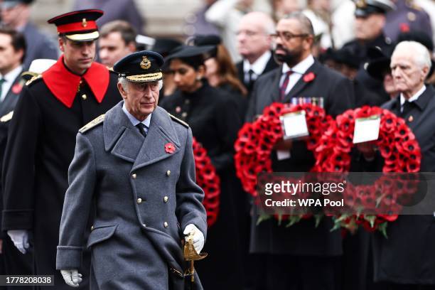 King Charles III followed by Britain's Prince William, Prince of Wales , arrives to attend the National Service of Remembrance at The Cenotaph on...