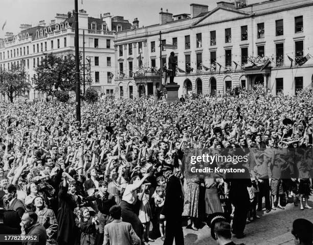 Crowd gathered in George Square to see Queen Elizabeth II and the Duke of Edinburgh during their visit to Glasgow, Scotland, 27th June 1953. This is...