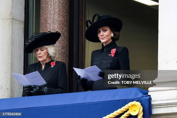 Britain's Queen Camilla and Britain's Catherine, Princess of Wales react as they attend the Remembrance Sunday ceremony at the Cenotaph on Whitehall...