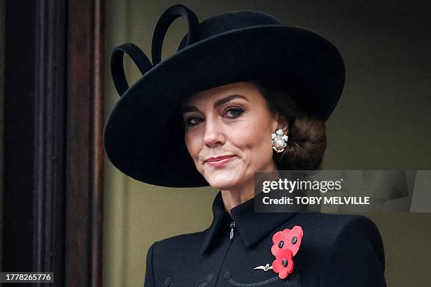 Britain's Catherine, Princess of Wales reacts as she attends the Remembrance Sunday ceremony at the Cenotaph on Whitehall in central London, on...