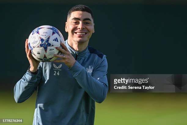 Miguel Almirón smiles as he holds on to a champions league ball during the Newcastle United Training Session at the Newcastle United Training Centre...