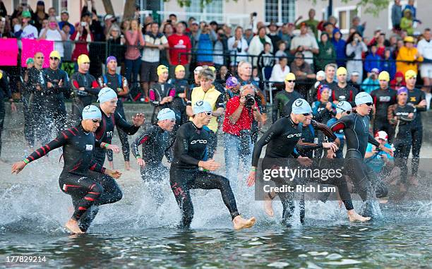 Athletes enter the water for the of the Challenge Penticton Triathlon on August 25, 2013 in Penticton, British Columbia, Canada.