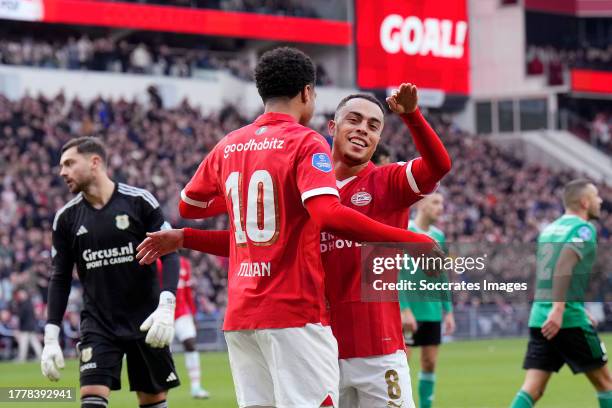 Malik Tillman of PSV celebrates 4-0 with Sergino Dest of PSV during the Dutch Eredivisie match between PSV v PEC Zwolle at the Philips Stadium on...