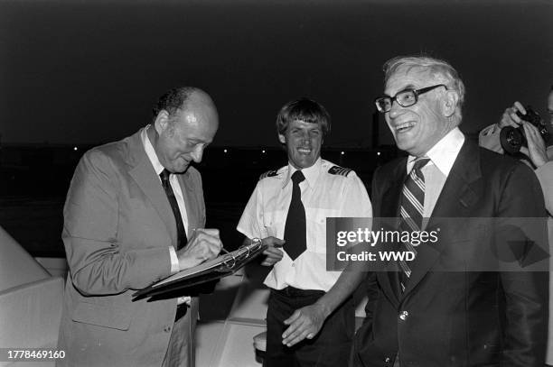 Ed Koch and Malcolm Forbes attend a party aboard the yacht "Highlander," docked in the waters off New York City, on August 20, 1981.