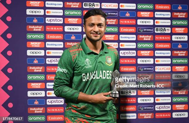 Shakib Al Hasan of Bangladesh poses after being named Player of the Match following the ICC Men's Cricket World Cup India 2023 between Bangladesh and...
