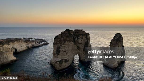 scenic view of sea against sky during sunset,beirut,lebanon - beiroet beach stockfoto's en -beelden