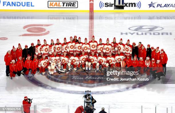 The Calgary Flames pose for a team photo before practice at Commonwealth Stadium on October 28, 2023 in Edmonton, Alberta.