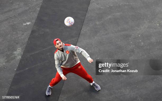 Dennis Gilbert of the Calgary Flames warms up with a soccer ball during Edmonton Oilers pract at Commonwealth Stadium on October 28, 2023 in...