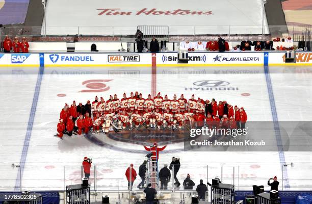 The Calgary Flames pose for a team photo before practice at Commonwealth Stadium on October 28, 2023 in Edmonton, Alberta.