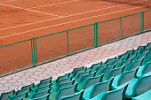 Grandstand seats and tennis court