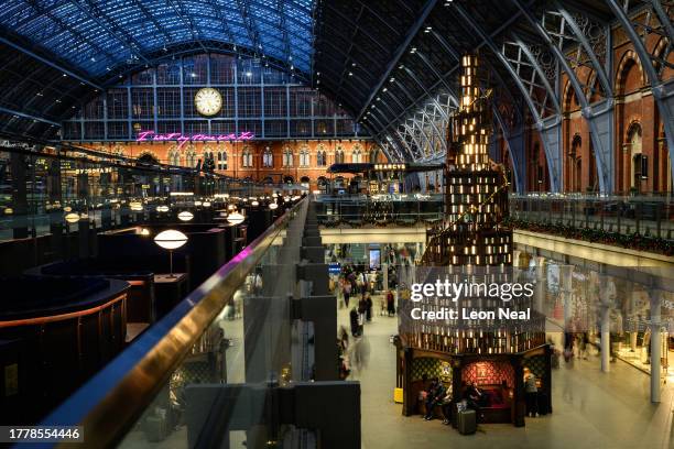 Large replica bookshelf in the shape of a Christmas tree is seen in Saint Pancras station on November 06, 2023 in London, England. The installation,...