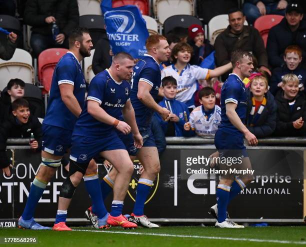 Wales , United Kingdom - 12 November 2023; Ciarán Frawley of Leinster, centre, celebrates with teammates after scoring his side's third try during...