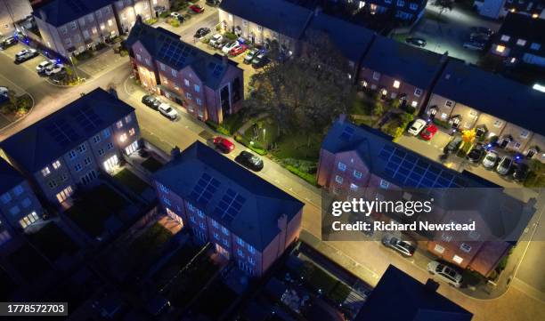 solar powered homes at night - solar street light stock pictures, royalty-free photos & images