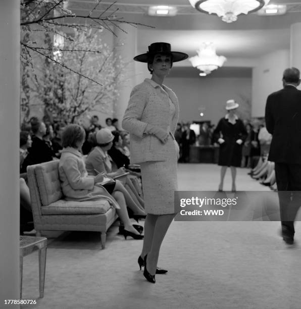 Model poses in the debut of the long line suit designed by Cristobal Balenciaga for Fall 1965.