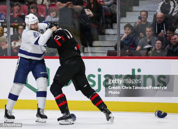 Austin Watson of the Tampa Bay Lightning fights Zack MacEwen of the Ottawa Senators during the first period at Canadian Tire Centre on November 04,...