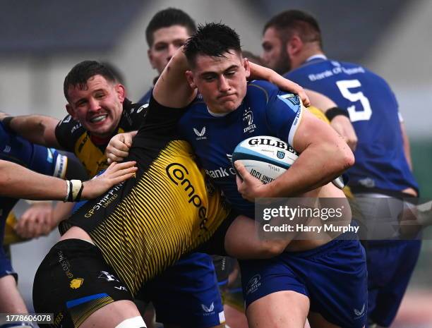 Wales , United Kingdom - 12 November 2023; Dan Sheehan of Leinster is tackled by Ryan Woodman of Dragons during the United Rugby Championship match...