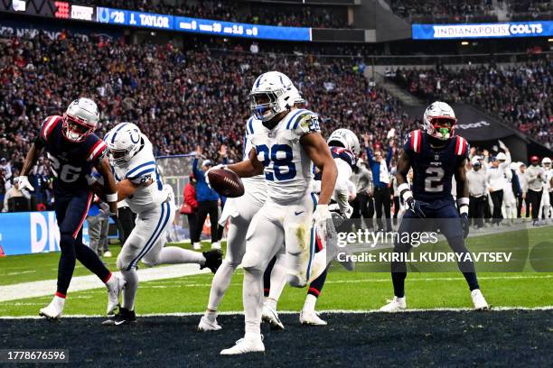 Indianapolis Colts' running back Jonathan Taylor scores a touchdown during the NFL American football match Indianapolis Colts vs New England Patriots...
