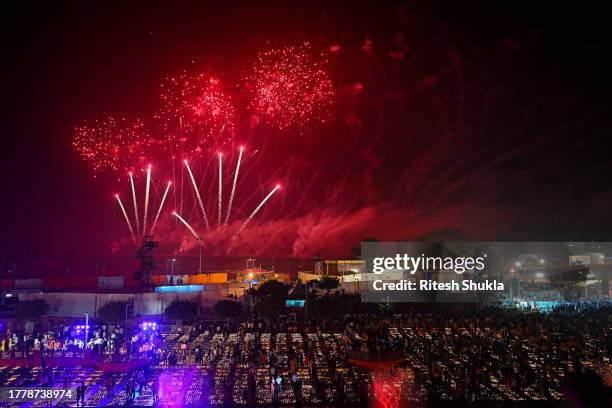 People gather on the banks of the Saryu River to watch fireworks during a cultural programme, on the eve of Diwali festival, on November 11 Ayodhya,...