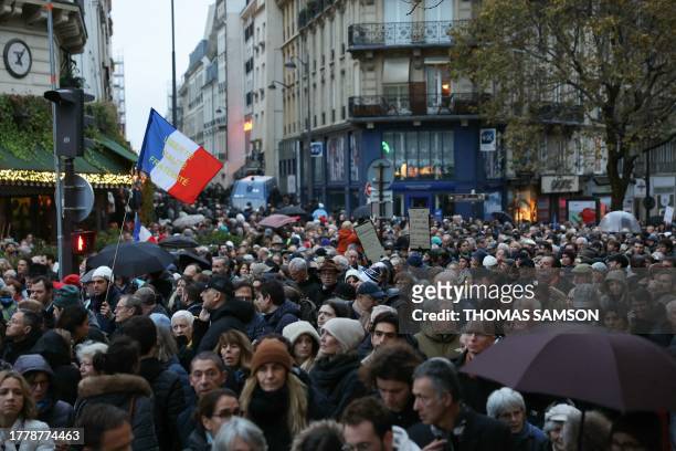 Protesters, waving a flag of France which reads as "Freedom, Equality, Fraternity" participate in a march against anti-Semitism in Paris, on November...