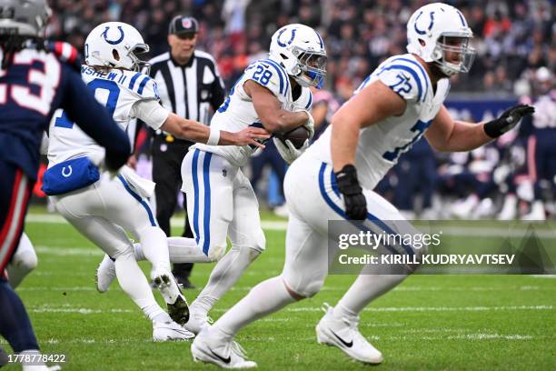 Indianapolis Colts' running back Jonathan Taylor runs with the ball during the NFL American football match Indianapolis Colts vs New England Patriots...