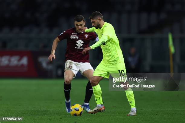 Domenico Berardi of US Sassuolo and Alessandro Buongiorno of Torino Fc battle for the ball during the Serie A TIM match between Torino FC and US...