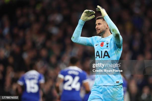 Guglielmo Vicario of Tottenham Hotspur reacts after Cole Palmer of Chelsea scores the team's first goal from the penalty spot during the Premier...