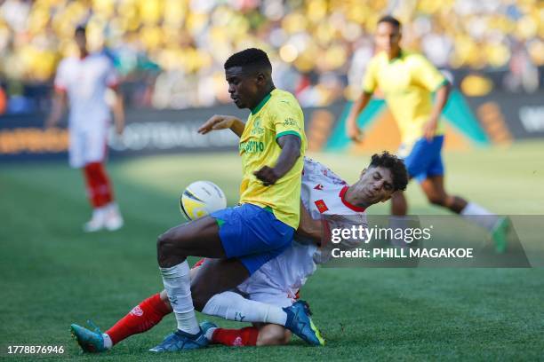 Wydad's Moroccan midfielder Abdellah Haimoud tackles Sundowns' South African midfielder Teboho Mokoena during the African Football League second-leg...