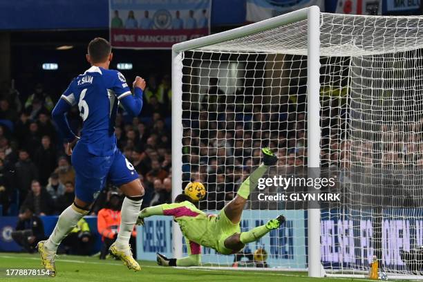 Chelsea's Brazilian defender Thiago Silva watches as his header beats Manchester City's Brazilian goalkeeper Ederson for their first goal during the...