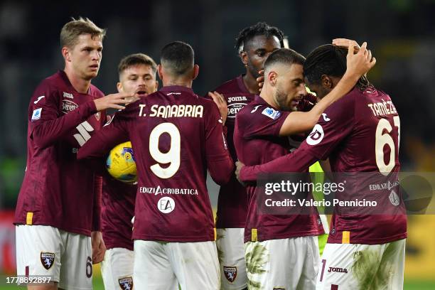 Nikola Vlasic of Torino FC celebrates with Adrien Tameze of Torino FC after scoring the team's second goal during the Serie A TIM match between...
