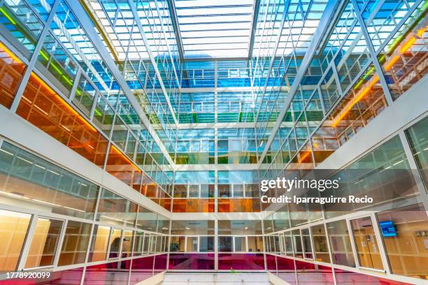 interiors of the modern hospital or medical center decorated by colors depending on the specialization of each floor, medical clinic - business operations stock-fotos und bilder