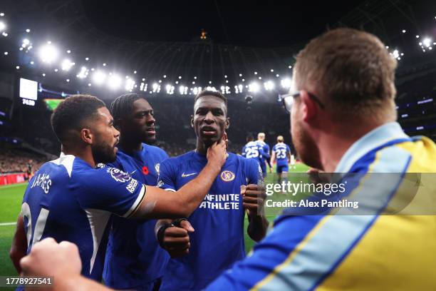 Nicolas Jackson of Chelsea celebrates with teammates Reece James and Axel Disasi of Chelsea after scoring the team's second goal during the Premier...