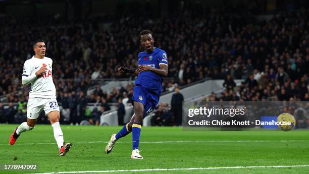 Nicolas Jackson of Chelsea scores their teams third goal during the Premier League match between Tottenham Hotspur and Chelsea FC at Tottenham...