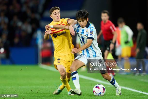 Pablo Martin Paez Gaviria 'Gavi' of FC Barcelona duels for the ball with Takefusa Kubo of Real Sociedad during the LaLiga EA Sports match between...