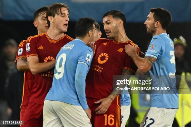 Lazio's Spanish forward Pedro argues with Roma's Argentinian midfielder Leandro Daniel Paredes during the Italian Serie A football match between...