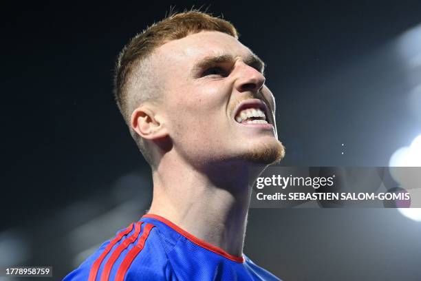 Lyon's Irish defender Jake O'Brien celebrates after opening the scoring during the French L1 football match between Stade Rennais FC and Olympique...