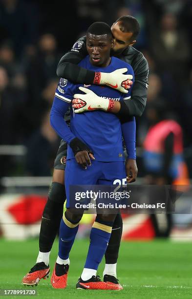 Robert Sanchez of Chelsea embraces Moises Caicedo of Chelsea during the Premier League match between Tottenham Hotspur and Chelsea FC at Tottenham...