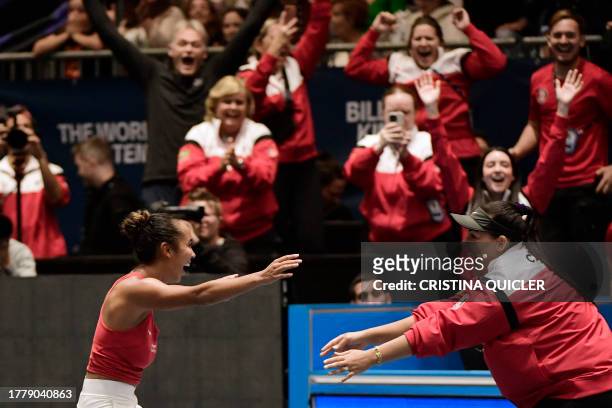 Canada's Leylah Fernandez celebrates with Canada's captain Heidi El Tabakh after beating Italy's Jasmine Paolini during the final singles tennis...
