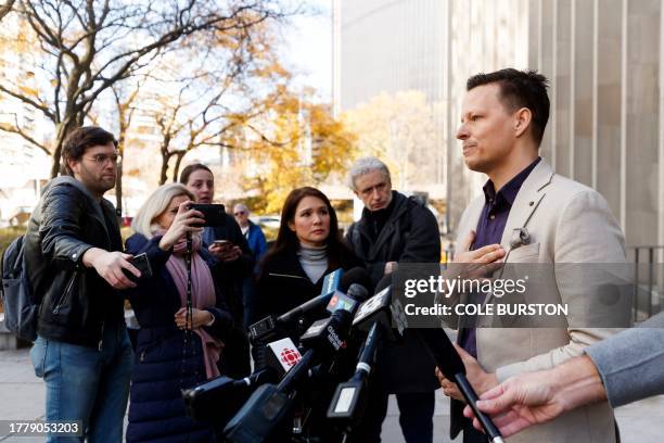 Kai Bickle-Nygard, son of former fashion mogul Peter Nygard, addresses media outside the Toronto courthouse in Toronto on November 12, 2023 after his...