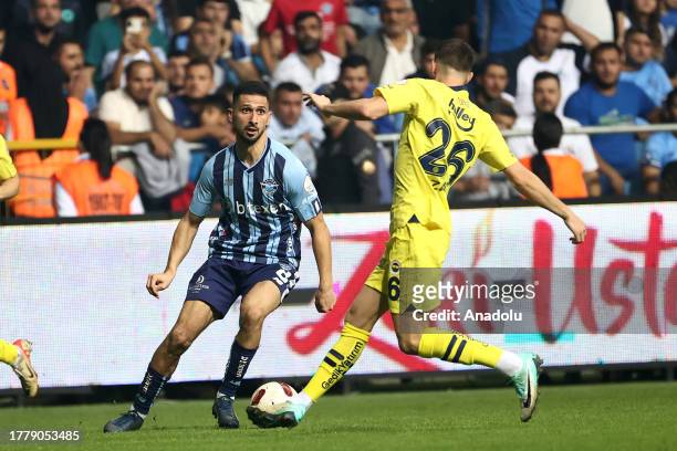 Zajc of Fenerbahce in action against Emre Akbaba of Yukatel Adana Demirspor during the Turkish Super Lig week 12 soccer match between Fenerbahce and...