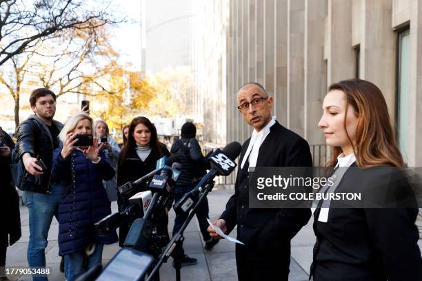 Crown attorneys Neville Golwalla and Ana Serban address media outside the Toronto courthouse in Toronto on November 12, 2023 after former fashion...