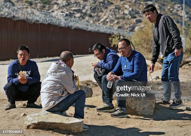 November 11: Chinese Migrants attempting to cross in to the U.S. From Mexico are detained by U.S. Customs and Border Protection at the border...