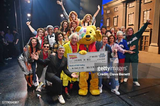 Pudsey poses backstage with Gary Davies and cast members including Oliver Nicholas, Sarah Goggin,, Lee Ormsby, Ben Joyce and Sophie Naglik at the...